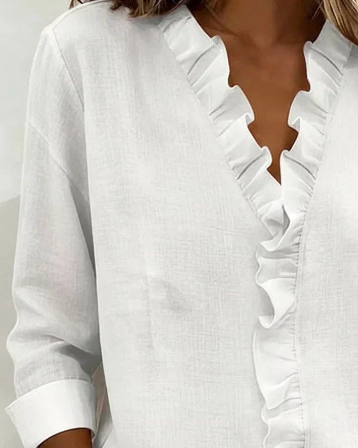 Carmen – Blusa elegante con escote en V y volantes suaves